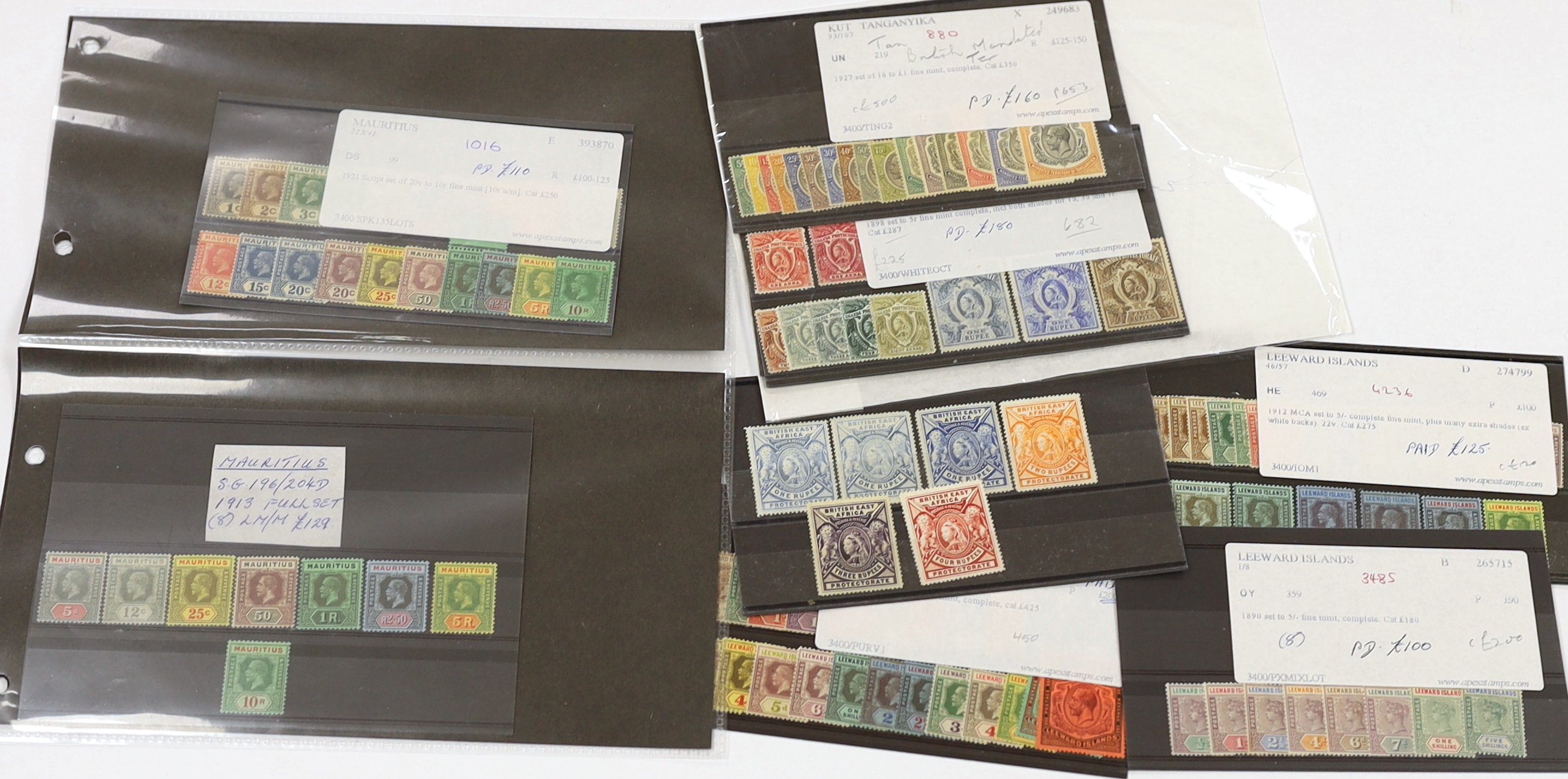 A selection of stamps including British East Africa, 1897 1r to 4r, Leeward Islands 1890 set, 1921 set to £1, K.U.T. 1912 1c to 10r, Tangyika 1927 to £1, Uganda 1898 set, Mauritius 1879-80 set, 1921 to 10r (2) etc.